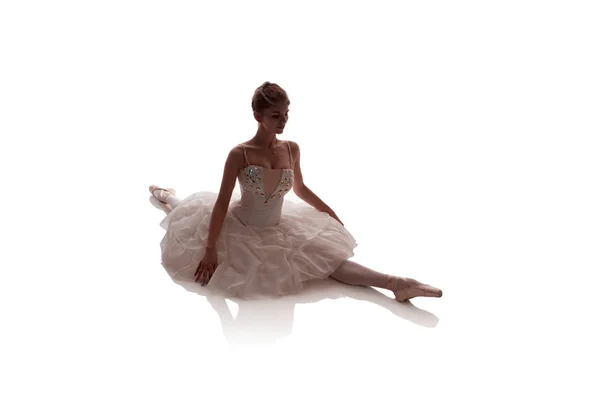 woman ballerina in white pack posing on white background, photo made in the style of 