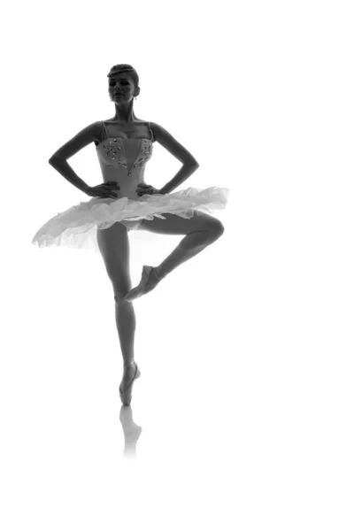 woman ballerina in white pack posing on white background, black and white photo made in the style of \