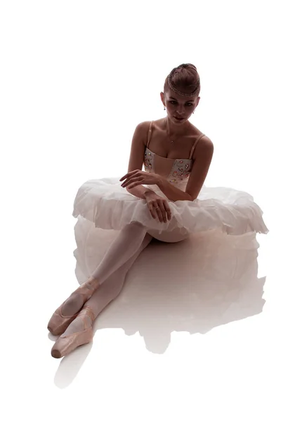 woman ballerina in white pack posing on white background, photo made in the style of \