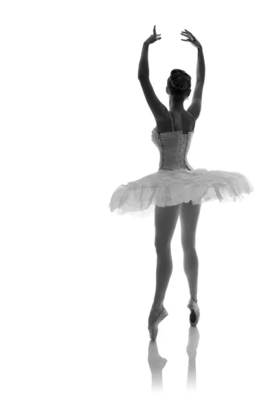 woman ballerina in white pack posing on white background, black and white photo made in the style of \
