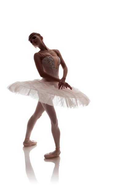 woman ballerina in white pack posing on white background, photo made in the style of \