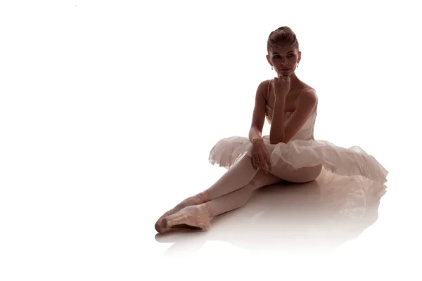 woman ballerina in white pack posing on white background, photo made in the style of 