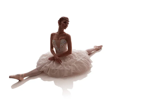 woman ballerina in white pack posing on white background, photo made in the style of \