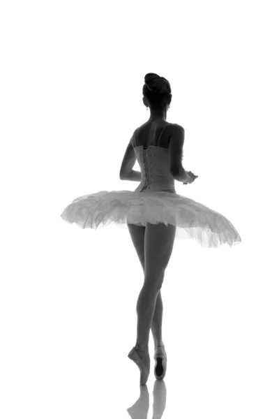 woman ballerina in white pack posing on white background, black and white photo made in the style of \