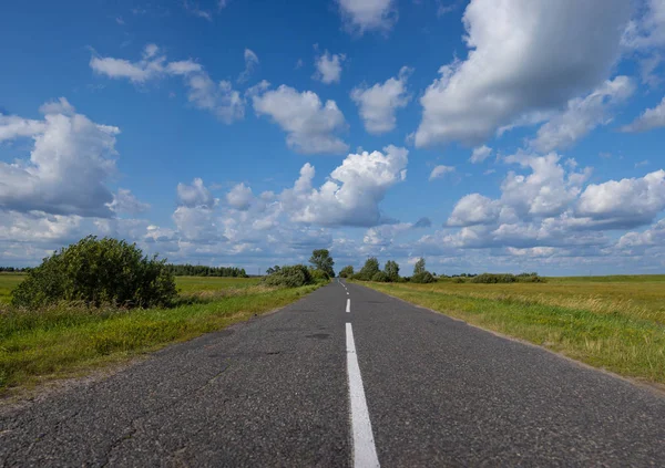 view of asphalt road on blue sky background