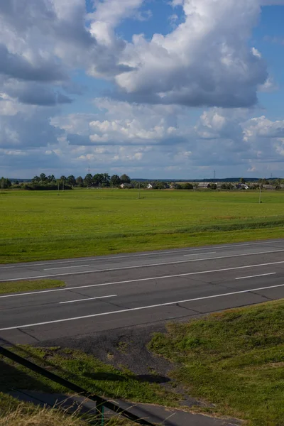 view of asphalt road on blue sky background