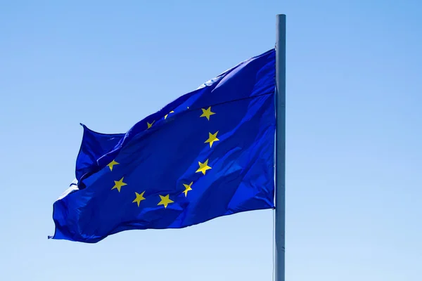 Europe union flag waving on blue sky background