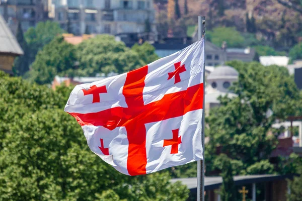 Georgian flag waving on blue sky background