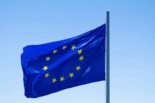 Europe union flag waving on blue sky background