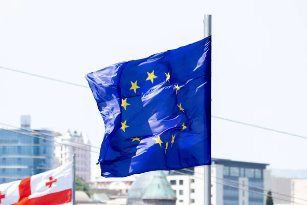 Europe union flag waving on blue sky background