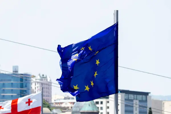 Europe union flag waving on blue sky background