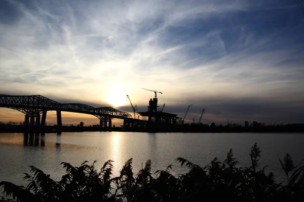 Bridge construction at sunset — Stock Photo, Image