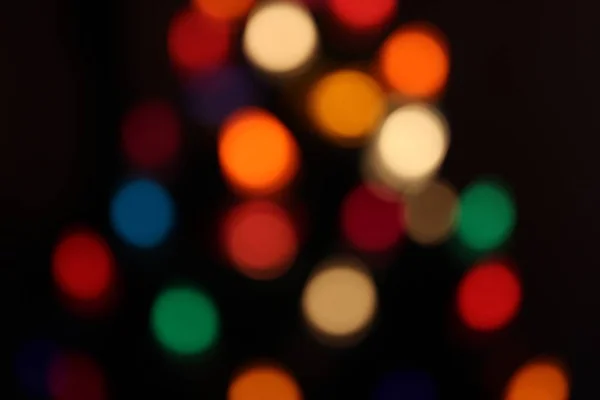 Bokeh de Navidad de las luces en un árbol de Navidad — Foto de Stock