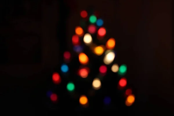 Christmas bokeh from lights in a christmas tree — Stock Photo, Image