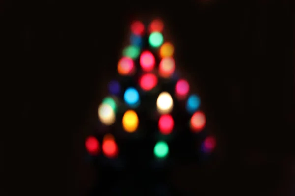 Kerst bokeh van lichten in een boom van de chrsitmas — Stockfoto