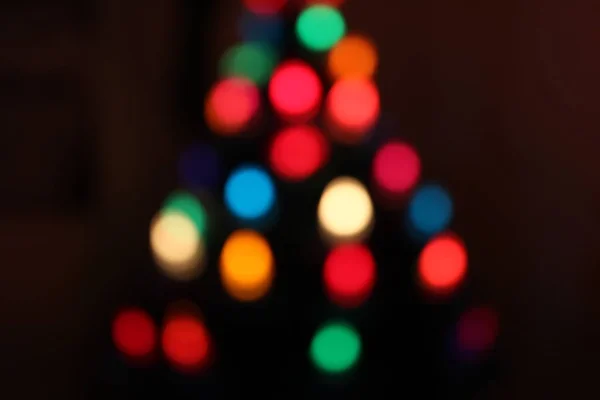 Χριστούγεννα bokeh από τα φώτα σε ένα δέντρο χρονόμετρο — Φωτογραφία Αρχείου