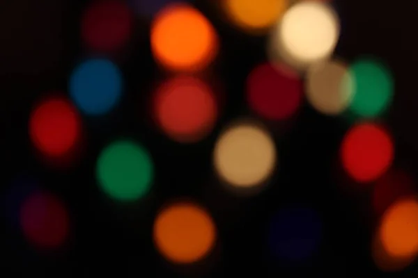 Christmas bokeh from lights in a chrsitmas tree — Stock Photo, Image