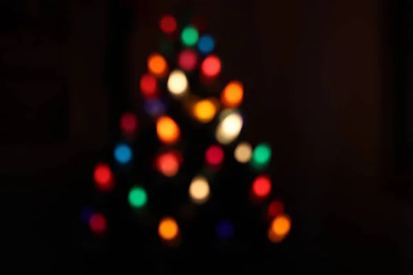 Christmas bokeh from lights in a chrsitmas tree — Stock Photo, Image