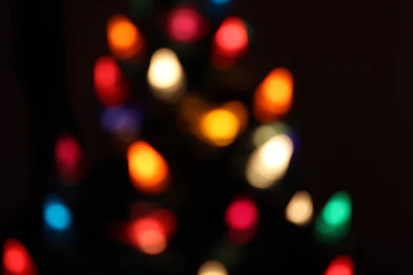 Bokeh de Navidad de las luces en un árbol de Navidad — Foto de Stock