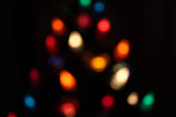 Christmas bokeh from lights in a chrsitmas tree — Stock Photo, Image