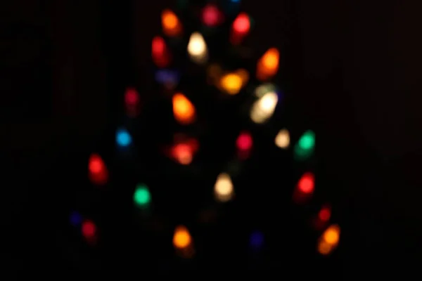 Christmas bokeh from lights in a chrsitmas tree — Stock Photo, Image