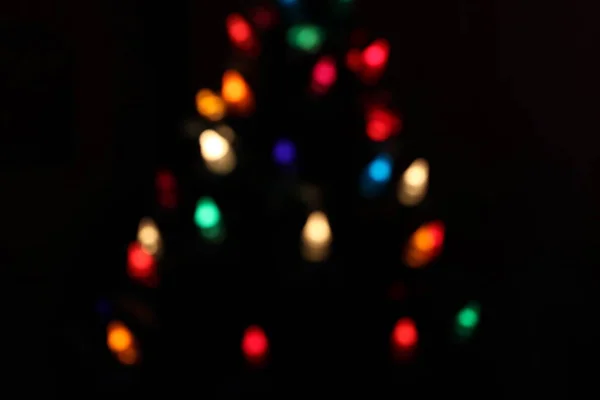 Christmas bokeh from lights in a chrsitmas tree — Stock Photo, Image