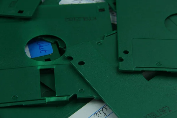 Old green floppy disks destroyed for recycling and security — Stock Photo, Image