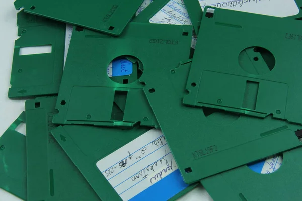 Old green floppy disks destroyed for recycling and security — Stock Photo, Image