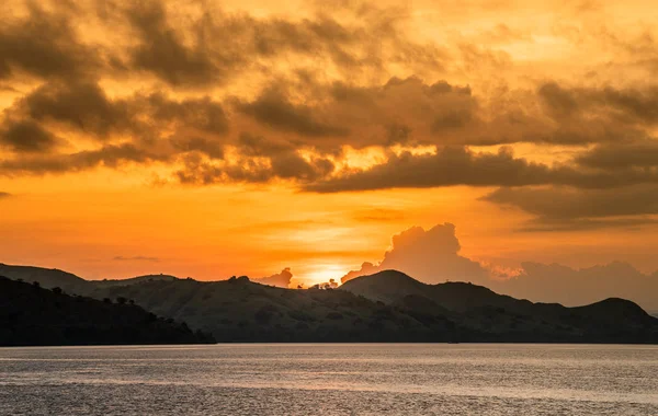 Twilight before sunset on the ocean coast. Ocean and mountains Landscap. Komodo Island. Moluccas, Indonesian Maluku, Spice Islands, Indonesian islands, Malay Archipelago.