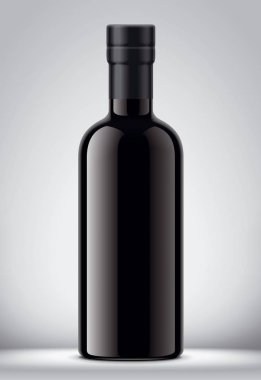 Gri arka planda cam siyah şişe