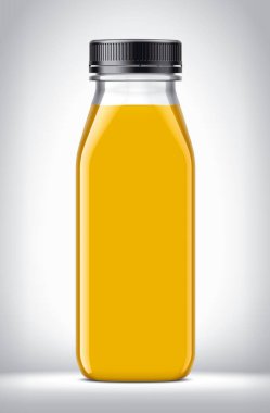Arkaplanda portakal suyu olan plastik şişe.. 