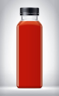 Arkaplanda domates suyu ile plastik şişe. 