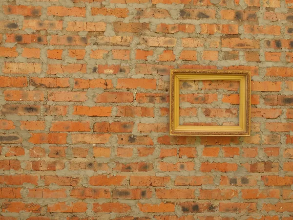 Moldura imagem de baguette no fundo de um velho tijolo wa — Fotografia de Stock