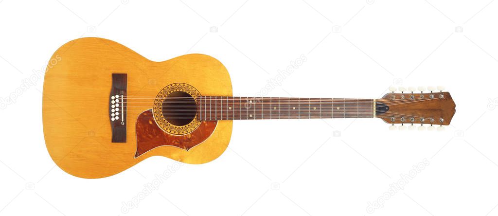 Musical instrument - Front view vintage twelve-string acoustic guitar isolated on a white background.