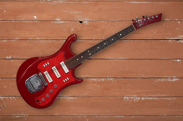 Instrumento musical - Vista superior retro rojo guitarra madera fondo — Foto de Stock