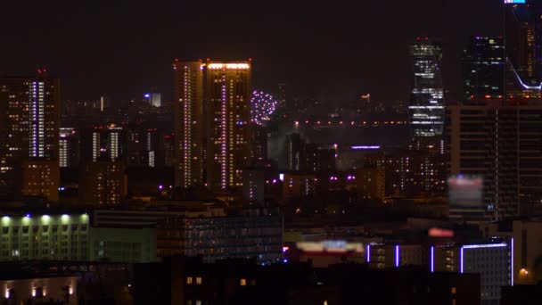 Beautiful fireworks in the city center on the background of skyscrapers — Stock Video