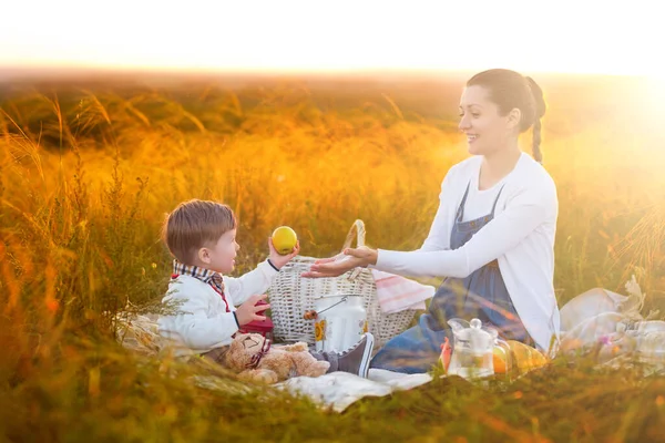 Mom Feeds Her Son Picnic Mother Young Son Sunny Fall — Stock Photo, Image