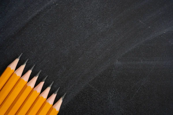 Pens on the background of blackboard. Back to school — Stock Photo, Image