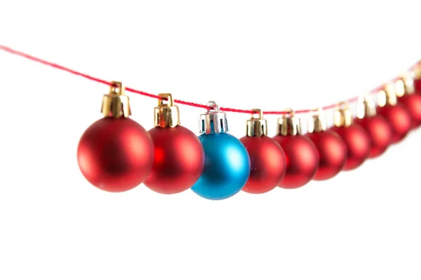 Line of red christmas balls on white background. Christmas decorations — Stock Photo, Image