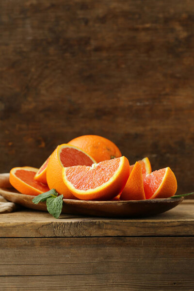 ripe organic red orange on wooden background