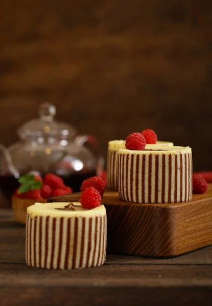 three chocolate cake with fresh raspberries