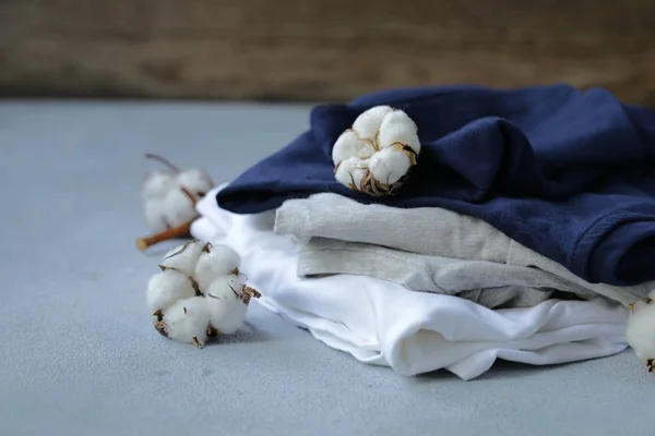 natural organic clothing from with twigs of cotton