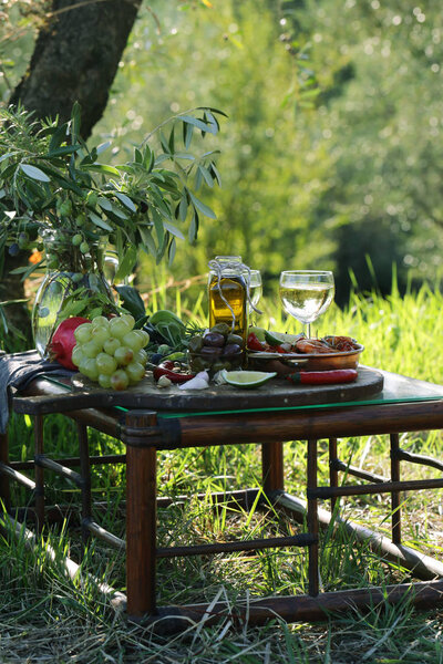 festive autumn table setting with fruits and cheese