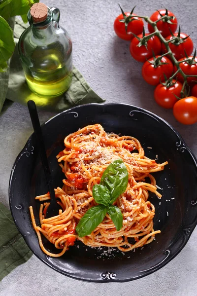 Italian pasta with tomato sauce and basil