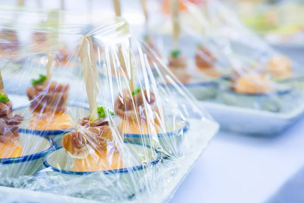 Canape ; Decoration and foods that are wrapped with plastic wrap prepared for the wedding