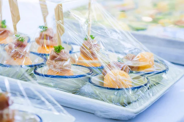Canape ; Decoration and foods that are wrapped with plastic wrap prepared for the wedding