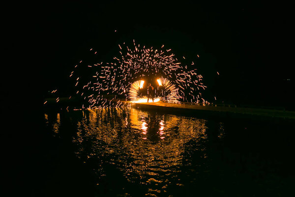 Fire show amazing at night in wedding party.