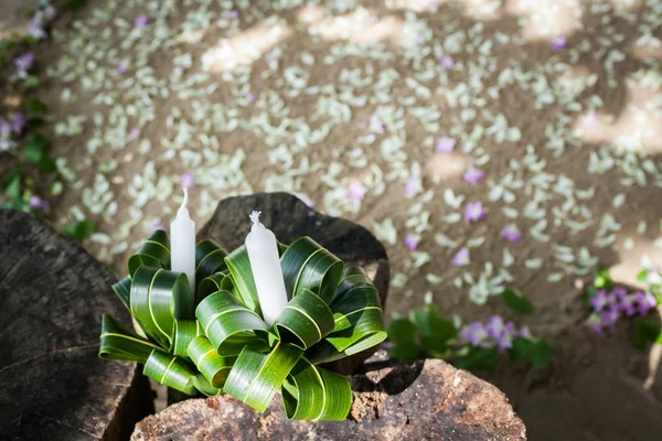 Floral arrangement at a wedding ceremony on beach.