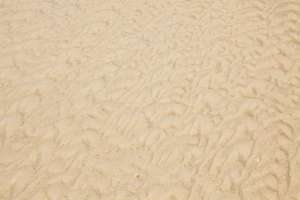 Текстура песка и фон — стоковое фото