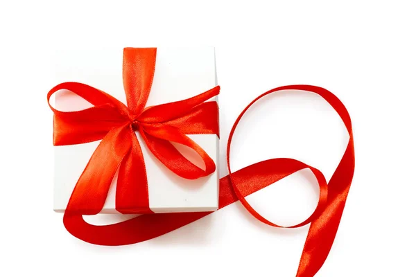 White Giftbox Red Ribbon Bow White Background — стоковое фото